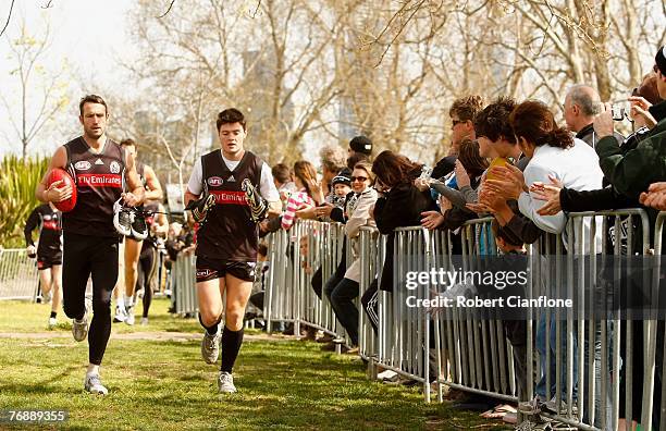 Shane Wakelin and Martin Clarke of the Magpies arrive prior to a Collingwood Magpies AFL training session held at Gosch's Paddock September 20, 2007...