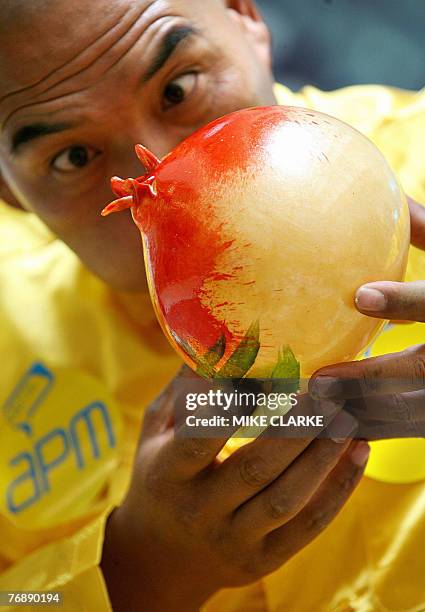 Stage performer Ma Chi Wang blows candy into various intricate animal shapes during a promotion for the upcoming moon festival in Hong Kong, 20...