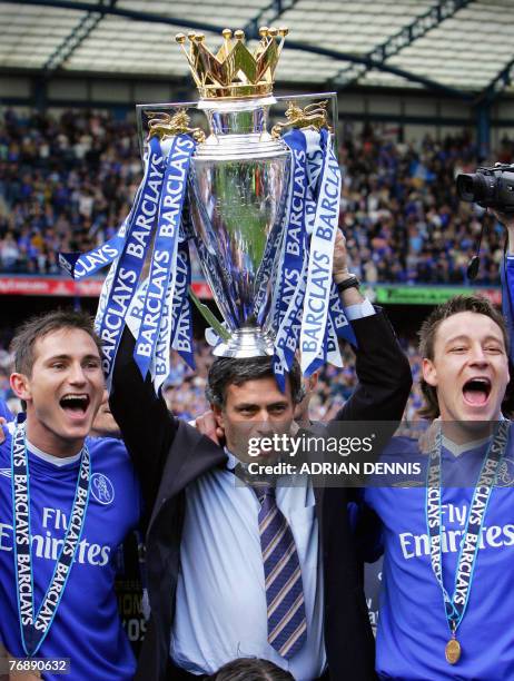 Chelsea's Manager Jose Mourinho holds aloft the Barclays Premiership trophy beside Frank Lampard and John Terry during the celebrations after the...