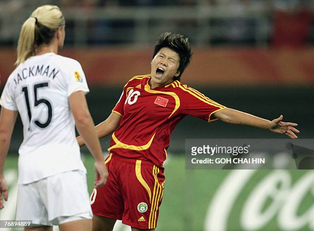 China's Ma Xiaoxu shows her dissappointment after missing an attempt at goal in their last group B match against New Zealand at the FIFA Women's...