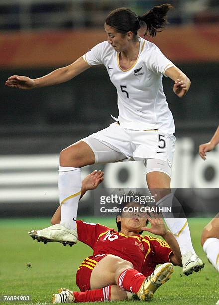 New Zealand's Abby Erceg jumps as China's Ma Xiaoxu goes for the ball during their last group B match at the FIFA Women's World Cup football...