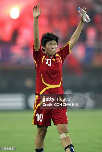 China's Ma Xiaoxu celebrates after her team's victory over New Zealand in their last group B match of the FIFA Women's World Cup football tournament...