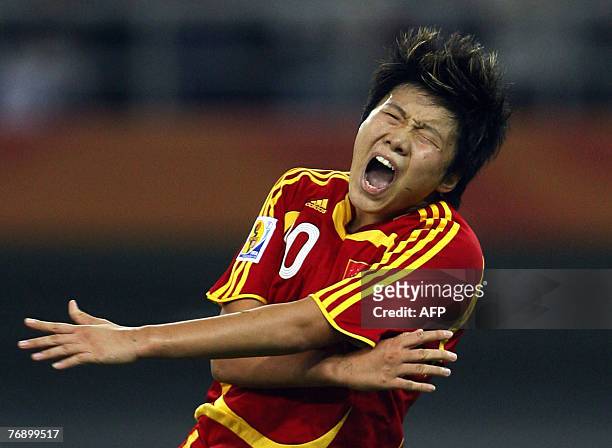 China's Ma Xiaoxu grimaces after missing a goal attempt against New Zealand in their last group B match of the FIFA Women's World Cup football...