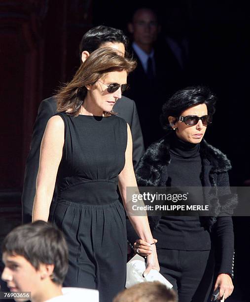 French first lady Cecilia Sarkozy accompanied by her close friend, Justice Minister Rachida Dati, leave Saint-Jean cathedral in Lyon, 20 September...