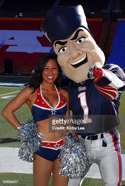 New England Patriots mascot Pat Patriot poses with Patriots cheerleader Briana Lee at NFL Pro Bowl Ohana Day Celebration at Aloha Stadium in...