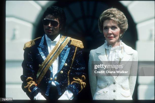 Michael Jackson and First Lady Nancy Reagan stand May 4, 1984 at the White House. Jackson began singing professionally at the age of eight, and...