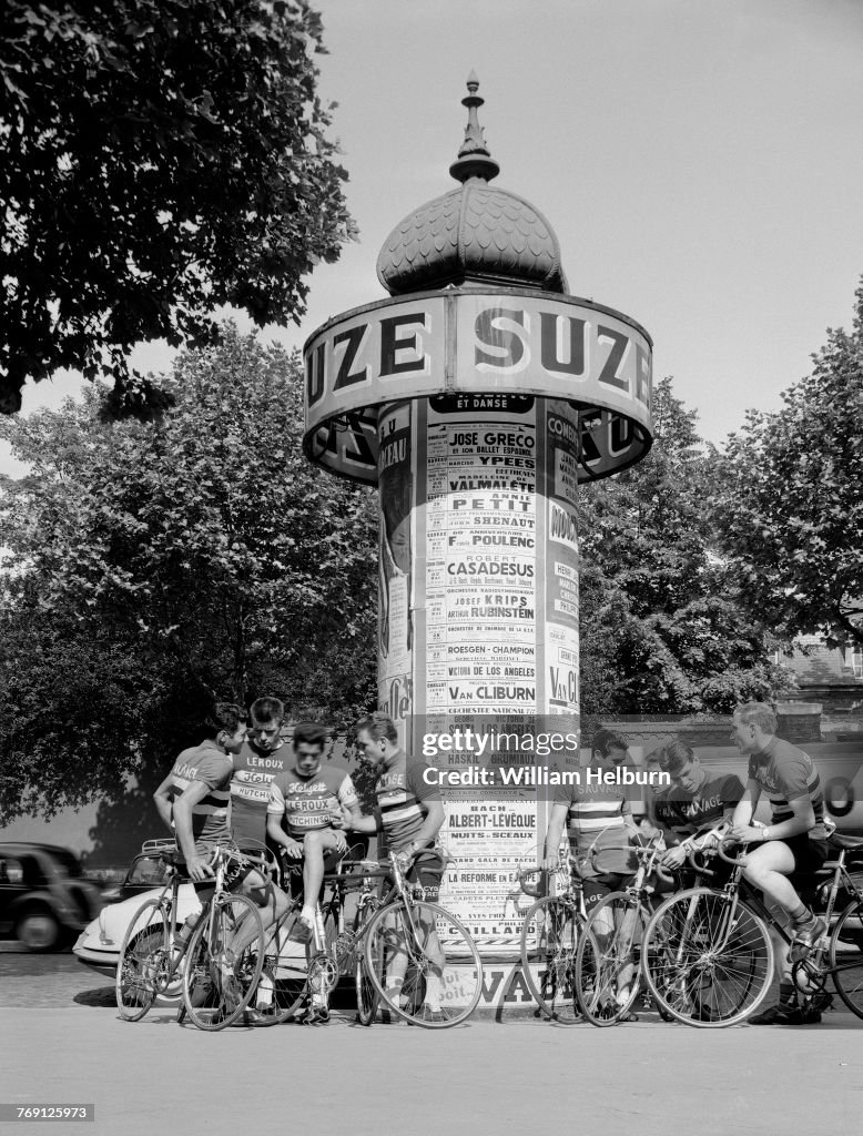 Cyclists At A Paris Kiosk