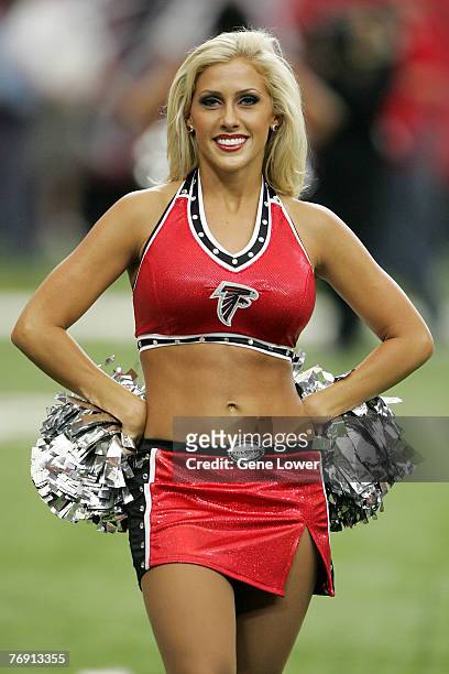 An Atlanta Falcons cheerleader shares a smile during a game versus the Arizona Cardinals, October 1 at the Georgia Dome, in Atlanta, GA. The Falcons...