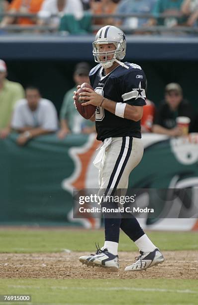 Tony Romo of the Dallas Cowboys goes back to pass during a game against the Miami Dolphins at Dolphin Stadium on September 16, 2007 in Miami, Florida.