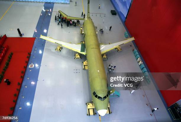 Near complete ARJ21 series aircraft, China's first domestically designed and manufactured commercial aircraft, is seen during a ceremony on September...