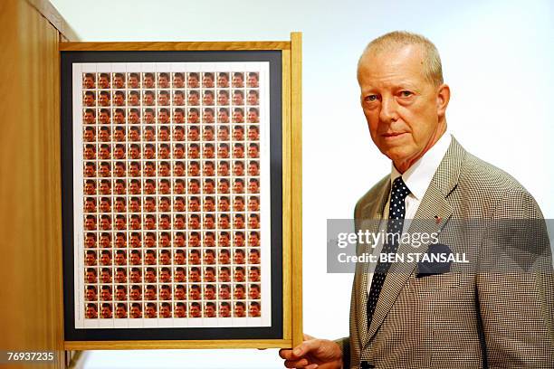 Roger Bacon poses with a collection of stamps featuring his son Major Matthew James Bacon, Intelligence Corps, who died serving in Iraq, 11 September...