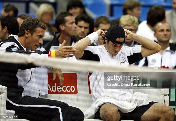 Team Captain Patrik Kuehnen of Germany gives instructions to Tommy Haas during the Davis Cup by BNP Paribas World Group Semi-final match between...
