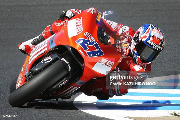 Australian Casey Stoner of Ducati Marlboro negotiates a corner during a Moto GP free practice session at Twin Ring Motegi, 21 September 2007....