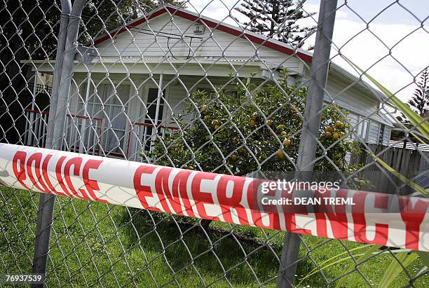 Police line is seen outisde the home of abandoned toddler, Qian Xun Xue known as "Pumpkin" in Auckland, 21 September 2007. A little girl abandoned at...