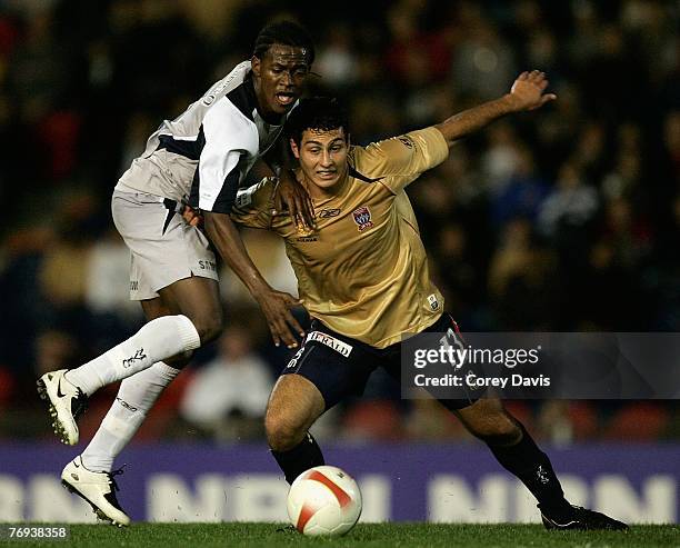 Leandro of the Victory and Adam D'Apuzzo of the Jets contest the ball during the round five A-League match between the Newcastle Jets and the...