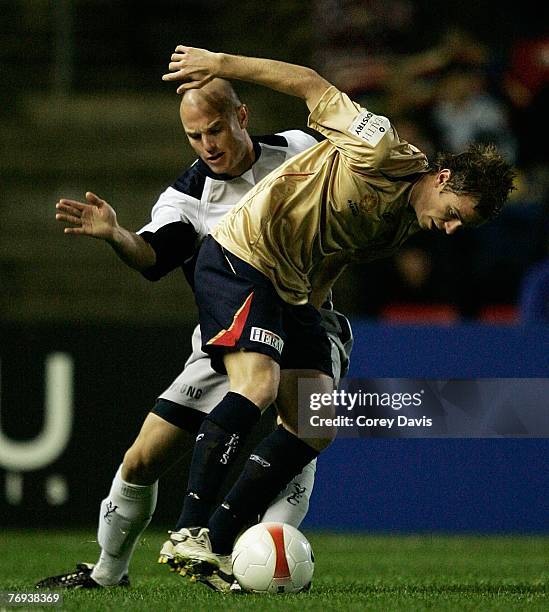 Matthew Kemp of the Victory tackles Matthew Thompson of the Jets during the round five A-League match between the Newcastle Jets and the Melbourne...