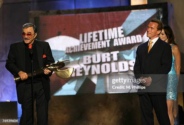 Burt Reynolds, recipient of the Taurus Lifetime Achievement Award for an Action Movie Star, and California Governor Arnold Schwarzenegger, presenter