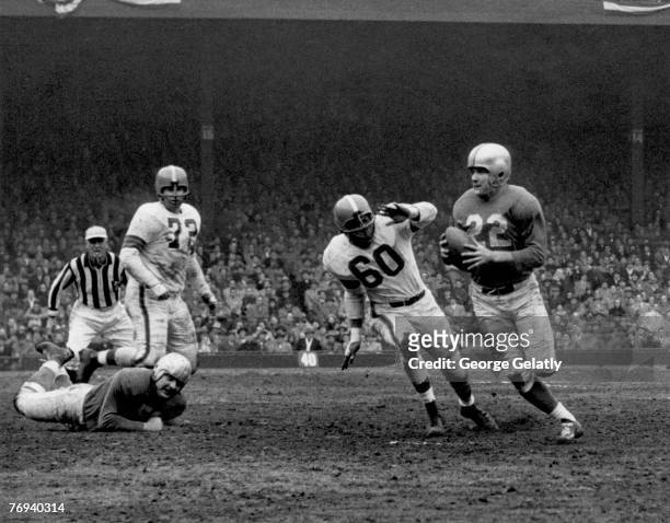 Detroit Lions quarterback Bobby Layne looks to pass in a 17-16 win over the Cleveland Browns in a League Championship game on December 27, 1953 at...