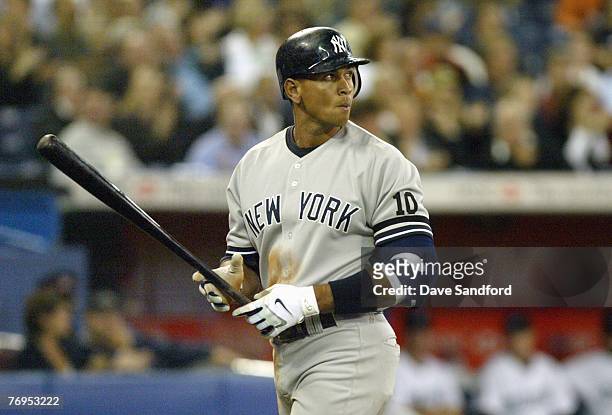 Alex Rodriguez of the New York Yankees walks off the field against the Toronto Blue Jays during their MLB game at the Rogers Centre September 13,...