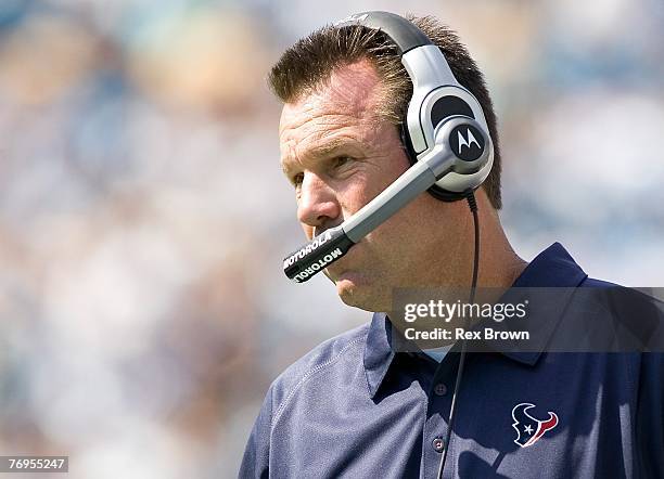Head coach Gary Kubiak of the Houston Texans looks to his team during the second half against the Carolina Panthers at Bank of America Stadium on...