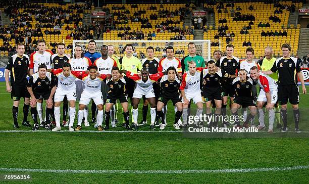 The players from both teams line up for the Fair Play team photo before the round five A-League match between the Wellington Phoenix and Adelaide...