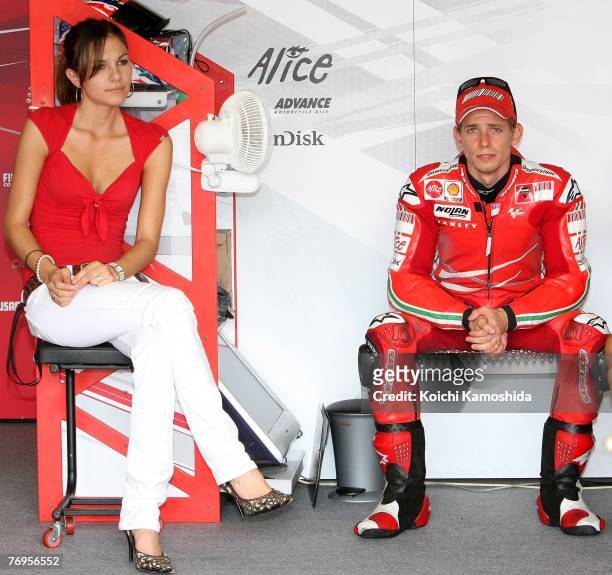 Casey Stoner of Australia and Ducati Marlboro team and his wife Adriana sit in the pit during the qualifying session for Round 15 of the 2007 MotoGP...