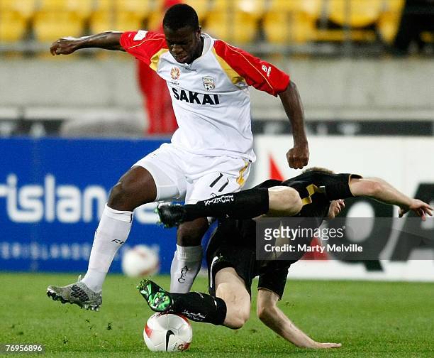 Bruce Djite of Adelaide tackles Karl Dodd of the Phoenix during the round five A-League match between the Wellington Phoenix and Adelaide United at...