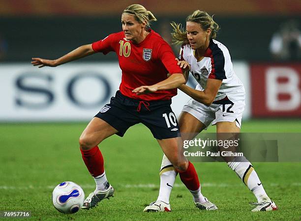 Kelly Smith of England battles for the ball with Leslie Osborne of United States during the Quarter Final of the Women's World Cup 2007 match between...