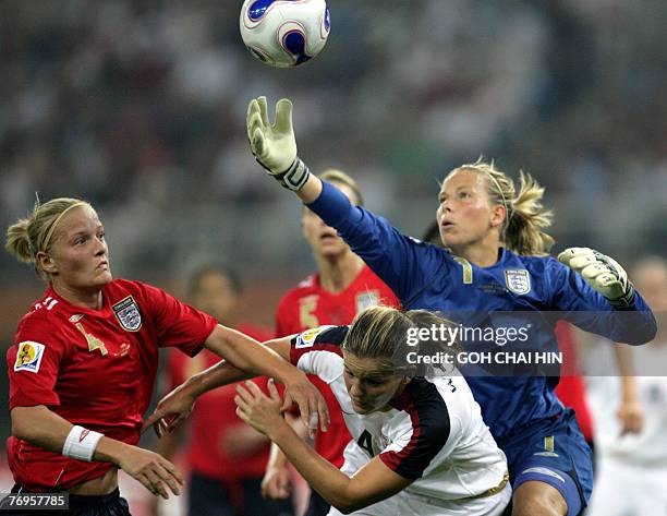 England's goalkeeper Rachel Brown goes for the ball against Cat Whitehill of the USA during their quarterfinal match of the FIFA Women's World Cup...