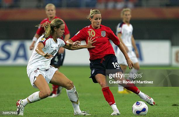 Midfielder Kelly Smith of England moves the ball against Leslie Osborne of USA during the quarter final of the Women's World Cup 2007 at Tianjin...