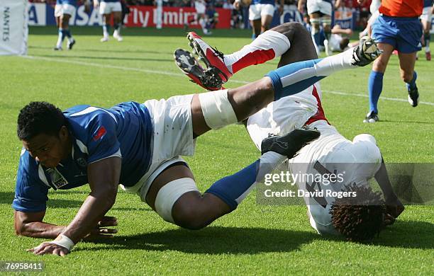 Paul Sackey of England dives on the kick through from teammate Jonny Wilkinson to score his team's second try during the Rugby World Cup 2007 Pool A...