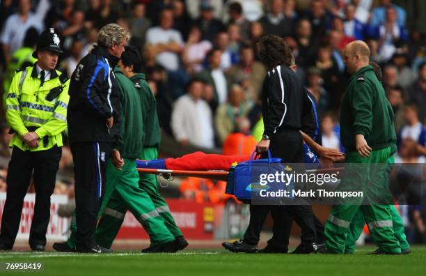 Steve Bruce manager of Birmingham City looks on as Borja Oubina is stretchered off to the Barclays Premier League match between Liverpool and...