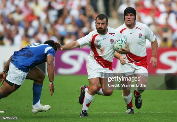George Chuter of England hands off Eliota Fuimaono-Sapolu of Samoa during the Rugby World Cup 2007 Pool A match between England and Samoa at the...