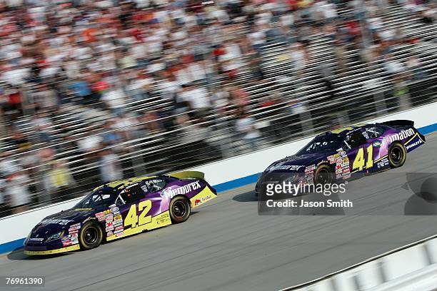 Allmendinger, driver of the Memorex Dodge, drives ahead of Bryan Clauson, driver of the imation Dodge, during the NASCAR Busch Series RoadLoans.com...