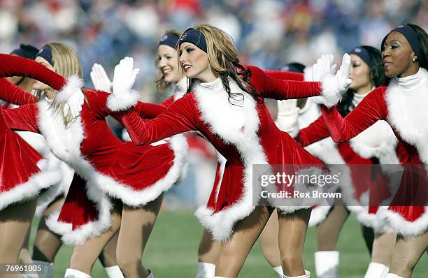 Titans cheerleaders work to get the crowd excited during a time out December 18 at the Coliseum, in Nashville, Tennessee. Seattle defeated Tennessee...