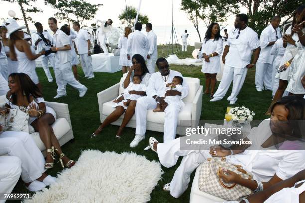 Host Sean "Diddy" Combs and Kim Porter with their twin daughters D'Lila Star Combs and Jessie James Combs pictured at "The Real White Party"...