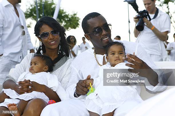 Host Sean "Diddy" Combs and Kim Porter with their twin daughters D'Lila Star Combs and Jessie James Combs pictured at "The Real White Party"...