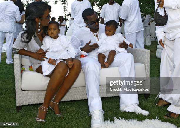Host Sean "Diddy" Combs and Kim Porter with their twin daughters D'Lila Star Combs and Jessie James Combs pictured at "The Real White Party"...