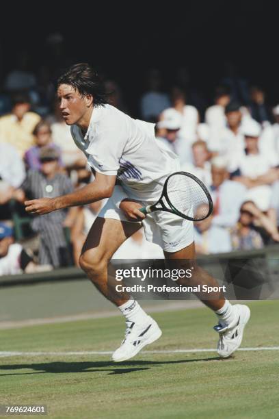 Australian tennis player Patrick Rafter pictured competing to reach the second round of the Men's Singles tournament at the Wimbledon Lawn Tennis...