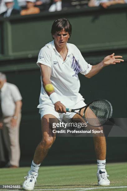 Australian tennis player Patrick Rafter pictured competing to reach the second round of the Men's Singles tournament at the Wimbledon Lawn Tennis...