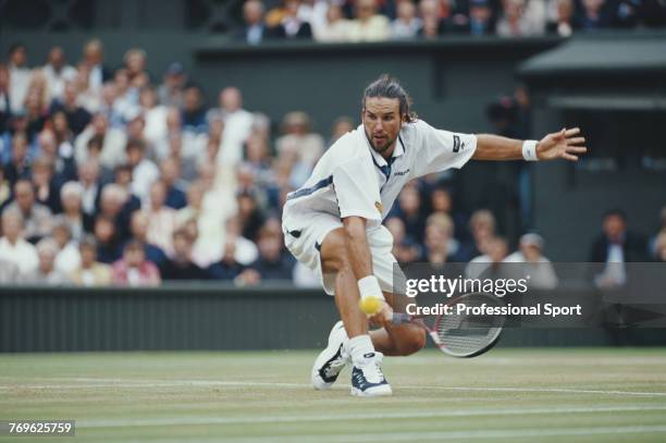 Australian tennis player Patrick Rafter pictured in action during competition to reach the final of the Men's Singles tournament at the Wimbledon...