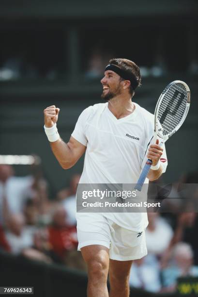 Australian tennis player Patrick Rafter pictured clenching a fist in triumph after defeating Andre Agassi of the United States 2-6, 6-3, 3-6, 6-2,...