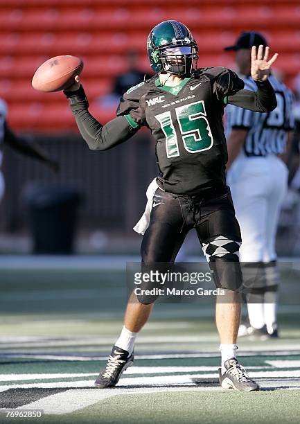 Quarterback Colt Brennan of the University of Hawaii Warriors practices on the field before the start of their game against the Charleston Southern...