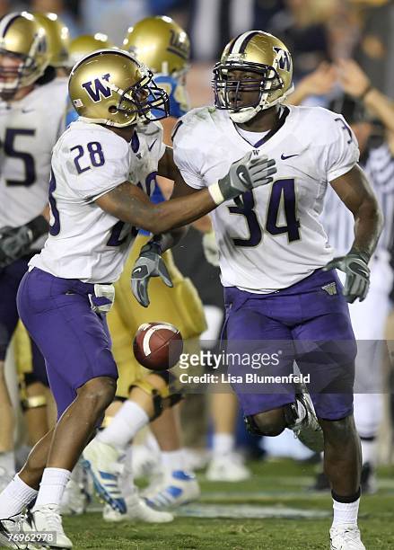 Tony Chidiac and Dan Howell of the Washington Huskies celebrate during the game against the UCLA Bruins at the Pasadena Rose Bowl on September 22,...