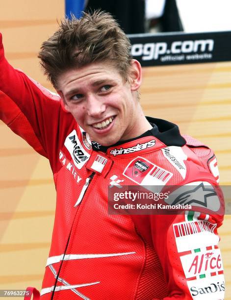 Casey Stoner of Australia and Ducati Marlboro celebrates winning the MotoGP World title after Round 15 of the 2007 MotoGP World Championship, the...