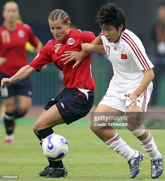 Norway's Trine Ronning and China's Ma Xiaoxu vie for the ball during the quarter-final of the FIFA Women's Football World Cup in Wuhan, in China's...