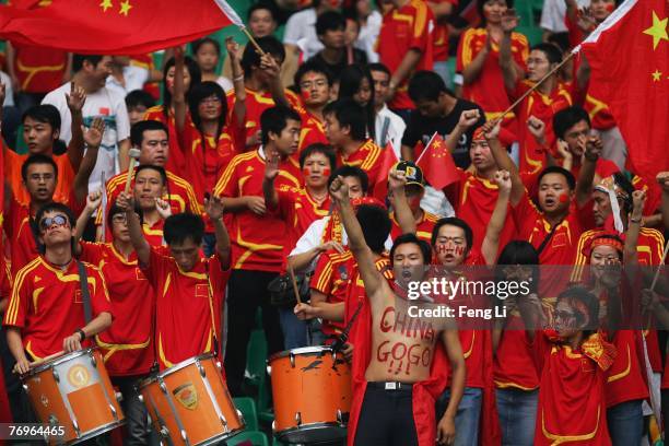 Fans of China cheer during the quarter final match of FIFA Women's World Cup China 2007 between China and Norway at Wuhan Sports Center Stadium on...