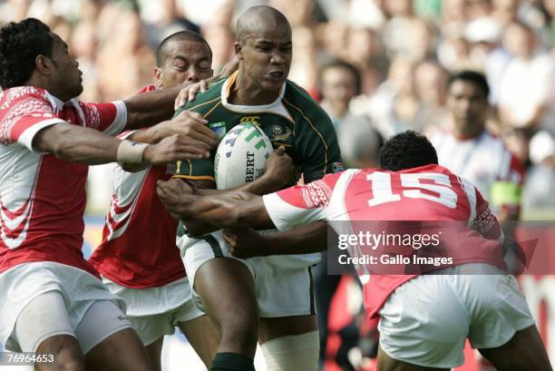 Pietersen stopped by Sukanaivalu Hufanga and Vungakoto Lilo during the 2007 Rugby World Cup match between South Africa and Tonga held at the Stade...