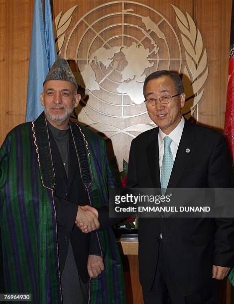 Afghan President Ahmid Karzai shakes hands with UN Secretary General Ban Ki-Moon during a meeting at the United Nations, 23 September 2007. Karzai is...
