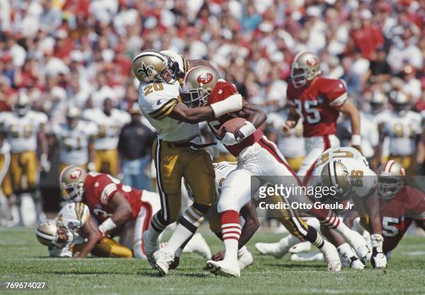 Othello Henderson, Defensive Back for the New Orleans Saints tackles Dexter Carter Running Back and kick returner for the San Francisco 49ers during...